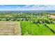 Expansive aerial view of neighborhood with lush greenery and open fields on a sunny day at 7655 N Kitchen Rd, Mooresville, IN 46158