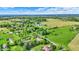 Lush, green neighborhood with diverse home styles and beautiful landscaping seen in aerial view at 7655 N Kitchen Rd, Mooresville, IN 46158
