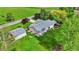 Bird's eye view of house featuring a well-manicured lawn, mature landscaping, and a cozy patio at 7655 N Kitchen Rd, Mooresville, IN 46158