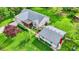 Aerial view of house showcasing expansive yard, well-maintained landscaping, and a detached garage at 7655 N Kitchen Rd, Mooresville, IN 46158