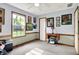 A blue bedroom featuring a sewing machine converted to a desk, wall art, and carpeted floors at 7655 N Kitchen Rd, Mooresville, IN 46158