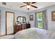 Bright bedroom featuring natural light, large dresser, and window with a garden view at 7655 N Kitchen Rd, Mooresville, IN 46158