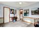 A blue bedroom featuring a sewing machine converted to a desk, wall art, and carpeted floors at 7655 N Kitchen Rd, Mooresville, IN 46158