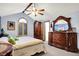 A luxurious bedroom with vaulted ceilings and stylish décor and ample dresser space at 7655 N Kitchen Rd, Mooresville, IN 46158