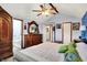 A spacious bedroom with vaulted ceilings, a water closet and stylish dark wood furniture at 7655 N Kitchen Rd, Mooresville, IN 46158