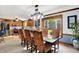 Open-concept dining room boasts a chandelier, large window, and wood trim at 7655 N Kitchen Rd, Mooresville, IN 46158
