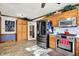 Modern kitchen with stainless appliances, wood cabinets, and an exterior view at 7655 N Kitchen Rd, Mooresville, IN 46158