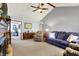 Spacious living room with a vaulted ceiling, fireplace, and neutral tones, creating a cozy atmosphere at 7655 N Kitchen Rd, Mooresville, IN 46158