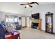 Cozy living room with fireplace, and comfortable seating, creating an inviting and relaxing space at 7655 N Kitchen Rd, Mooresville, IN 46158