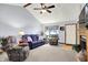 Inviting living room with vaulted ceilings, plush seating, and a large window with natural light at 7655 N Kitchen Rd, Mooresville, IN 46158