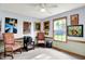 Bright, carpeted office space with natural light from the window and decorated with assorted artwork at 7655 N Kitchen Rd, Mooresville, IN 46158