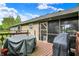Screened-in patio, perfect for outdoor dining, with a table and grill ready for summer barbecues at 7655 N Kitchen Rd, Mooresville, IN 46158