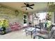 Relaxing screened patio features comfortable furniture and views of the outdoor space at 7655 N Kitchen Rd, Mooresville, IN 46158