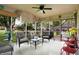 Inviting sunroom with comfortable seating, ceiling fan, and serene backyard views at 7655 N Kitchen Rd, Mooresville, IN 46158