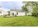 Expansive backyard with well-maintained lawn and deck, ideal for outdoor activities and relaxation at 7703 Park North Lake Dr, Indianapolis, IN 46260