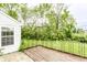 Well-kept wooden deck overlooking the lawn and bordered by lush greenery at 7703 Park North Lake Dr, Indianapolis, IN 46260