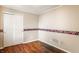 Bright bedroom with wood floors and closet at 7703 Park North Lake Dr, Indianapolis, IN 46260