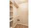 Bright, functional closet featuring built-in shelving and rod for optimal storage at 7703 Park North Lake Dr, Indianapolis, IN 46260