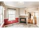 Cozy dining area featuring stylish tile flooring, a stone fireplace, and natural light at 7703 Park North Lake Dr, Indianapolis, IN 46260
