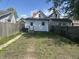 Backyard with a small lawn area, fence, and a detached garage at 810 S 18 Th St, Elwood, IN 46036
