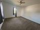 Bright bedroom featuring a ceiling fan and neutral walls and floors at 810 S 18 Th St, Elwood, IN 46036