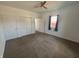Neutral bedroom with a ceiling fan, two closets and a window at 810 S 18 Th St, Elwood, IN 46036