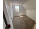 Cozy bedroom with carpet, white walls, and a window with natural light at 810 S 18 Th St, Elwood, IN 46036