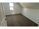 Bedroom featuring neutral carpet, white walls, and a bright window at 810 S 18 Th St, Elwood, IN 46036