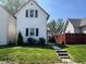 Charming two-story home with red roof and a well-maintained front yard at 810 S 18 Th St, Elwood, IN 46036