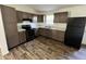 Modern kitchen with new appliances, countertops, wood flooring, and ample cabinet space at 810 S 18 Th St, Elwood, IN 46036