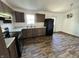 Well-lit kitchen featuring new appliances and plenty of cabinet space with dark wood flooring at 810 S 18 Th St, Elwood, IN 46036