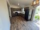 Bright and spacious kitchen with modern countertops, sleek appliances, and warm wood floors at 810 S 18 Th St, Elwood, IN 46036