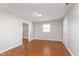 Spacious bedroom with neutral paint, wood flooring and a window at 8144 E 50Th St, Indianapolis, IN 46226