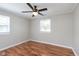 Bright bedroom features wood flooring, ceiling fan, and trim work at 8144 E 50Th St, Indianapolis, IN 46226