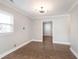 Cozy dining room featuring tile flooring, a modern light fixture, and easy access to other rooms at 8144 E 50Th St, Indianapolis, IN 46226