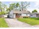 Cozy single-Gathering home with a driveway, manicured lawn, and a welcoming front entrance at 8144 E 50Th St, Indianapolis, IN 46226