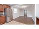 Bright kitchen features stainless steel refrigerator and tile flooring, with an adjacent eating area at 8144 E 50Th St, Indianapolis, IN 46226