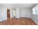 Open living space with hardwood floors and neutral paint, leading to the kitchen at 8144 E 50Th St, Indianapolis, IN 46226