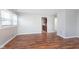 Well-lit living room featuring hardwood floors, neutral wall paint, and an open layout at 8144 E 50Th St, Indianapolis, IN 46226