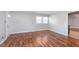 Inviting living area with hardwood floors, a window, and a view to the entrance at 8144 E 50Th St, Indianapolis, IN 46226