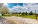 Wooden back deck overlooking a spacious yard with a shed and mature trees at 8630 E Mcgregor Rd, Indianapolis, IN 46259