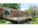 Wood deck with stairs off a brick home, overlooking a verdant yard at 8630 E Mcgregor Rd, Indianapolis, IN 46259