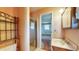 Modest bathroom featuring shower with glass door, a vanity, and a view into bedroom at 8630 E Mcgregor Rd, Indianapolis, IN 46259