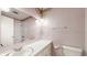 Bathroom features a shower, vanity, mirror and toilet under bright lights at 8630 E Mcgregor Rd, Indianapolis, IN 46259