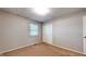 Bedroom with carpet, neutral paint, closet and a window providing a light-filled atmosphere at 8630 E Mcgregor Rd, Indianapolis, IN 46259
