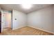 Bare bedroom with carpet and neutral paint with view into another room at 8630 E Mcgregor Rd, Indianapolis, IN 46259