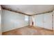Spacious bedroom featuring neutral carpet, light blue walls, and adjacent bathroom access at 8630 E Mcgregor Rd, Indianapolis, IN 46259