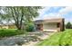 Charming one-story brick home with a two-car garage and mature trees at 8630 E Mcgregor Rd, Indianapolis, IN 46259