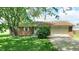 Charming single-story brick home with a well-manicured lawn and an attached garage at 8630 E Mcgregor Rd, Indianapolis, IN 46259