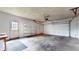 The spacious garage has shelving for storage at 8630 E Mcgregor Rd, Indianapolis, IN 46259